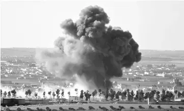  ??  ?? Smoke rises from the northern Syrian town of al-Bab, Syria. — Reuters photo