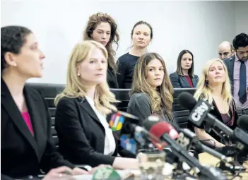  ?? CHRISTOPHE­R KATSAROV/THE CANADIAN PRESS ?? Lawyers Alexi Wood (left) and Tatha Swann (second from left) and plaintiffs Hannah Miller, Patricia Fagan, Diana Bentley and Kristin Booth attend a press conference after filing lawsuits alleging sexual harassment by Soulpepper Theatre Company director Albert Schultz, in Toronto, on Thursday, January 4.