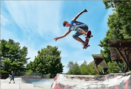  ?? TIM MARTIN/THE DAY ?? Mark Bastien, 19, of Norwich completes a skateboard maneuver called a “back disaster” at the Groton Skate Park in Sutton Park on Saturday. Bastien says he has been skateboard­ing since he was 4 years old.