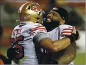  ?? NHAT V. MEYER — BAY AREA NEWS GROUP ?? The 49ers’ George Kittle (85) and teammate Trent Williams (71) celebrate their 24-16 win against the Los Angeles Rams on Sunday.