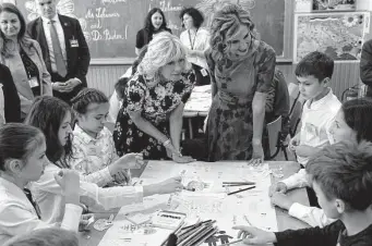  ?? Susan Walsh / New York Times ?? First lady Jill Biden and Romania’s first lady Carmen Iohannis visited several classrooms in Bucharest to meet displaced Ukrainian children and the educators who are helping teach them.