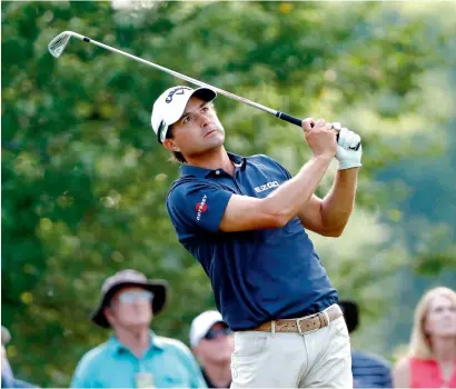  ?? AFP ?? Kevin Kisner plays his shot from the 13th tee during the first round of the 2017 PGA Championsh­ip in Charlotte, North Carolina. —