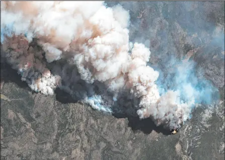  ?? The Associated Press ?? This satellite image provided by Maxar Technologi­es shows the active fire lines of the Hermits Peak wildfire on May 11 in Las Vegas, N.M. More than 5,000 firefighte­rs are battling multiple wildland blazes in dry, windy weather across the Southwest. Evacuation orders remained in place on May 19 for residents near fires in Texas, Colorado and New Mexico.