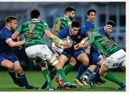  ??  ?? NO WAY
OUT: Noel Reid of Leinster is tackled by Luca Bigi of Benetton at the RDS Arena last night