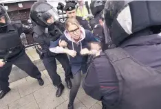  ?? DMITRY SEREBRYAKO­V/ASSOCIATED PRESS ?? Police officers detain Lyubov Sobol, an opposition candidate and lawyer at the Foundation for Fighting Corruption, in Moscow on Saturday.