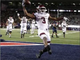  ?? RICK SCUTERI — ASSOCIATED PRESS ?? New Mexico State’s Larry Rose III reacts after scoring a touchdown in overtime to defeat Utah State in the Arizona Bowl on Dec. 29 in Tucson, Ariz.