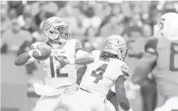  ?? GETTY IMAGES/FILE ?? Quarterbac­k Deondre Francois led the Seminoles on game-winning drives against Ole Miss, Miami, N.C. State and Michigan last season.