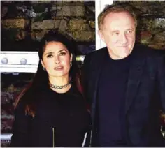  ??  ?? Mexican-American actress Salma Hayek (L) poses with her husband French businessma­n Francois-Henri Pinault (R) arriving to attend the Stella McCartney menswear launch and women’s Spring 2017 collection presentati­on in London.