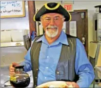  ?? CHRIS BARBER — DIGITAL FIRST MEDIA ?? Former owner Peter Skiadas, in this photo circa 2009, serves breakfast at Hank’s Place.