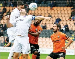  ?? PIC: Steve McLennan ?? HEADS UP: Fylde’s Jordan Tunnicliff­e, left, rises highest