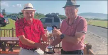  ??  ?? Machrie Bay’s Brian Sherwood presents Campbell Laing with the Lawson-Cameron trophy.