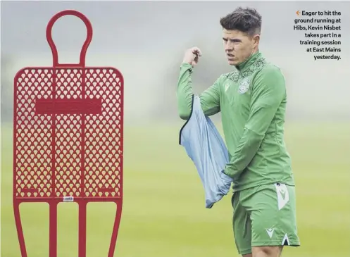  ??  ?? 2 Eager to hit the ground running at Hibs, Kevin Nisbet
takes part in a training session at East Mains
yesterday.