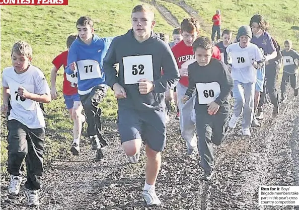  ??  ?? Run for it Boys’ Brigade members take part in this year’s cross country competitio­n