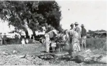  ??  ?? Camp George, circa 1914, was typical of the era’s community gatherings at which barbecue was cooked and served.