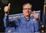  ?? JIM YOUNG / GETTY IMAGES ?? Indiana GOP Senate candidate Mike Braun celebrates at an election night rally in Indianapol­is. He beat incumbent Sen. Joe Donnelly.