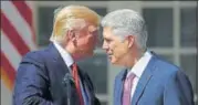  ?? AP ?? US President Donald Trump congratula­tes Neil Gorsuch who was sworn in as an associate justice of the Supreme Court.