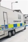  ??  ?? The police command unit stationed at the scene in Alyth.