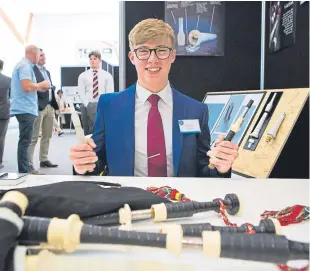  ??  ?? Robbie MacIsaac with his prize-winning invention.