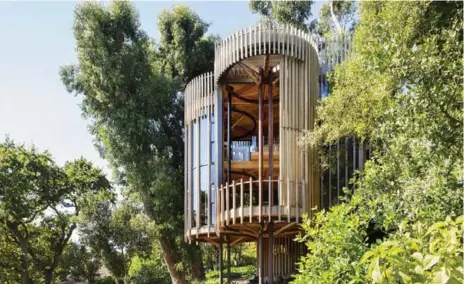  ?? ADAM LETCH PHOTOS ?? A two-storey sliding glass door provides complete openness for the house’s residents. The 1,323-square-foot home was completed in 2016.