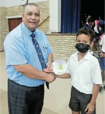  ?? ?? NURTURING TALENT: PAHS principal Nigel Adams ran an internal raffle for those who played table tennis at the school carnival and the winner of the raffle was Darshwin Somerset, who received a Stagg table tennis bat
