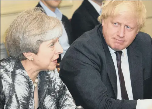  ??  ?? Prime Minister Theresa May with Foreign Secretary Boris Johnson, who has denied he has his eye on her job.