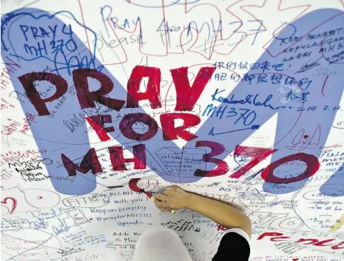  ?? MANAN VATSYAYANA / AFP / GETTY IMAGES FILES ?? A theory aired on Australian television suggests that the pilot of Malaysia Airlines Flight MH370, which disappeare­d en route from Kuala Lumpur to Beijing in March 2014, was deliberate­ly downed by pilot Zaharie Ahmad Shah.