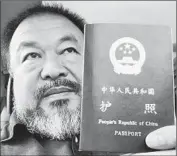  ?? Ai Weiwei ?? DISSIDENT ARTIST Ai Weiwei took a selfie with his returned passport after four years without it.