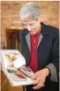  ?? Marie D. De Jesús / Chronicle ?? Holocaust survivor Chaja Verveer looks over the book “Taking Flight.”