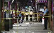  ?? DAKOT A SANTIAGO/THE NEW YORK TIMES ?? Fourteen victims were taken to hospitals in Philadelph­ia after a shooting that took place in a lively area with many restaurant­s and bars.