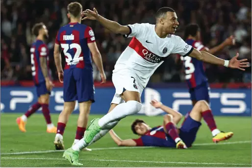  ?? — AFP ?? Paris Saint-germain’s French forward Kylian Mbappe celebrates scoring his second goal against Barcelona.