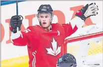  ?? CP PHOTO ?? Team Canada centre Jonathan Toews celebrates his goal as Team Europe defenceman Mark Streit looks on during first period World Cup of Hockey action in Toronto on Sept. 21.