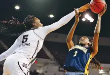  ??  ?? UTC forward Jasmine Joyner (3) reacts as her shot at the basket is knocked away by Mississipp­i State forward Sherise Williams (5) during the second half of Friday’s NCAA tournament game in Starkville. Joyner scored 17 points, but Mississipp­i State won...