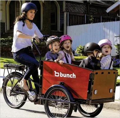  ?? COURTESY OF BUNCH BIKES ?? Make fitness a family affair with a cargo bike that’s ideal for pedaling and toting the kiddos around.