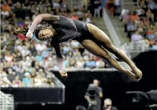  ?? AP ?? Simone Biles’ gravity-defying performanc­e would have had Isaac Newton questionin­g his life’s work.