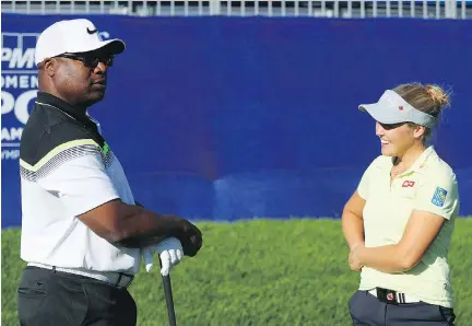  ?? GETTY IMAGES FOR KPMG ?? Former NFL and pro baseball star Bo Jackson chats with Canadian golfer Brooke Henderson during the pro-am at the KPMG Women’s LPGA Championsh­ip on Tuesday. Jackson said it was exciting to watch Henderson play. “She hits the ball farther than we do,” he...