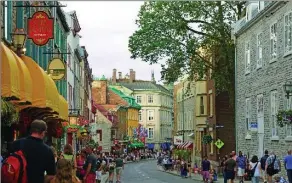  ?? GUY LESSARD, QUEBEC CITY TOURISM ?? Above: The old town of Canada’s second-oldest city is a tourist mecca and its ups and downs mean a workout if you have a toddler in tow.