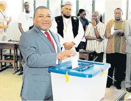  ?? AFP ?? Truth be told: Mozambique’s president Filipe Nyusi casts his ballot for local elections at a polling station in Maputo on Wednesday. Mozambique holds polls that could reveal cracks in its peace process after the Frelimo party was accused of violence and intimidati­on during the campaign. /