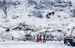  ?? TOR ERIK SCHROEDER NTB via AP ?? Rescue crews work in the area at Ask in Gjerdrum, Norway, on Saturday after a massive landslide smashed into a residentia­l area near the Norwegian capital early Wednesday.