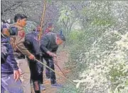  ?? ANI ?? Police search the forest area to look for other body parts of victim Shraddha Walker, in Mehrauli, New Delhi on Friday.