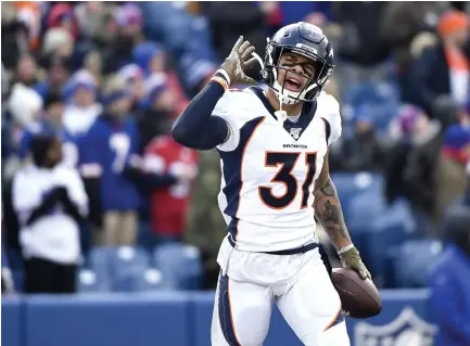  ?? Joe Amon, The Denver Post ?? Broncos safety Justin Simmons celebrates after he intercepts the ball last season against the Buffalo Bills.