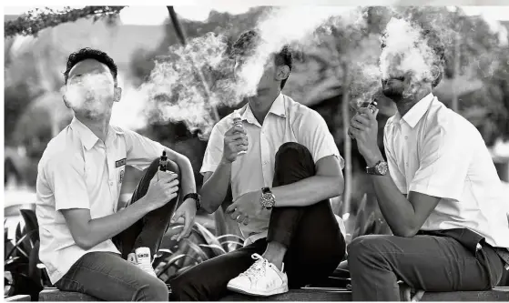  ?? — RAJA FAISAL HISHAN/The Star. ?? A posed picture of youths vaping.