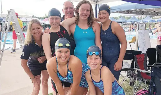  ??  ?? Enjoying the swim meet are (from left) Jo Ballantyne (coach), Marigold Hay, Andrew Marks (coach), Isabel Oswald, Lily Digrandi (front) Ellie Holden and Isabelle Nash.