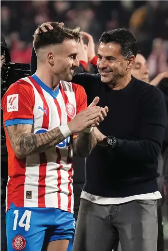  ?? EPA ?? Girona head coach Michel celebrates with Aleix Garcia after their 4-3 win over Atletico Madrid