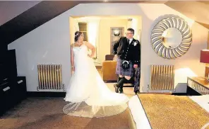  ??  ?? Honeymoon suite Toni and Martin pose in their luxury room at Lochside House Hotel