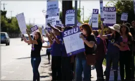  ?? ?? Members of the SEIU strike outside of the Department of Social Services on North King Road in San Jose on Wednesday.