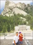  ?? Mia Malafronte / Contribute­d photo ?? Chip Malafronte with his son, John Paul, outside Mount Rushmore National Memorial in South Dakota. The two enjoyed traveling to national parks and baseball parks together, according to the family.