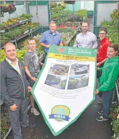  ?? Southwest Booster photo ?? Jeff Smith, Regional Vice President for Canadian Tire Corp.; Ilze Mouton; Michel Deguire, Dealer Swift Current's Canadian Tire store; Dale Brock, District Support Manager for Saskatchew­an; Shawn Wiskar and Melanie Giesbrecht unveil the Best Summer...