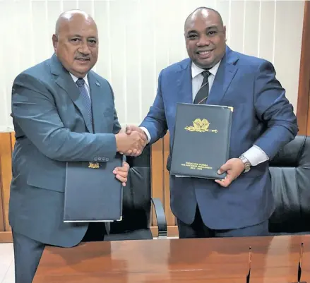  ?? Photo: Foreign Affairs. ?? Ratu Inoke Kubuabola (left) with Jelta Wong after the signing the Memorandum of Understand­ing on Police Co-operation.