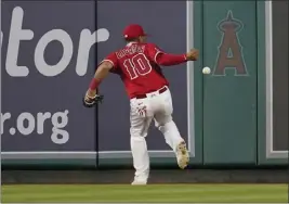  ?? ASHLEY LANDIS — THE ASSOCIATED PRESS ?? Angels right fielder Juan Lagares misses a line drive hit by Toronto's Lourdes Gurriel Jr. during the fifth inning of Friday's game at Angel Stadium. The Angels lost 4-3.