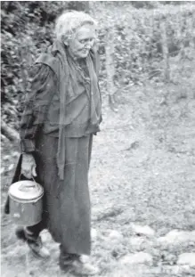  ?? ?? Nora Hogan drawing water from the well circa 1950. (Pic: Willie O’Brien)